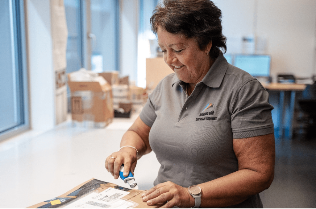 Technical specialist handling life-support equipment at the A-SS workshop